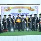 Foto: Bupati Achmad Fauzi Wongsojudo di Sidang Terbuka Promosi Doktor pada Program Pascasarjana Universitas Merdeka Malang, berhasil mempertahankan disertasinya di hadapan promotor dan penguji Unmer Malang, dan meraih predikat cumlaude, di Unmer Malang, Jumat (12/07/2024).
