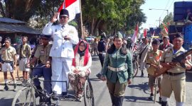 Ilustrasi karnaval kemerdekaan yang biasanya menjadi simbol kebersamaan rakyat. Tahun ini, Kecamatan Manding kehilangan tradisi tersebut
