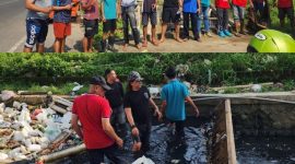Anggota JSI, DLH, dan PKDI bahu-membahu membersihkan area rawan sampah sebagai bentuk kampanye kepedulian lingkungan.